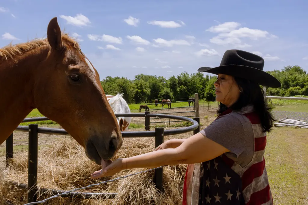 Rena Schroeder with her horse Blaze on her ranch, where she runs an equine learning nonprofit and cares for rescue livestock, in Lott on May 4, 2026.