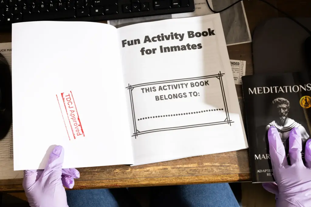 Page stamps books for approval after scanning them for possible contraband.