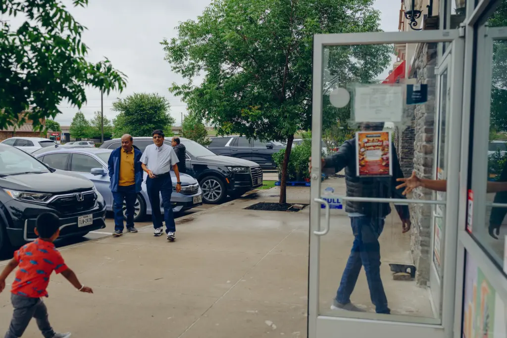 People gather at Swadeshi Plaza, an Indian grocery store and restaurant in Frisco on April 21, 2026.