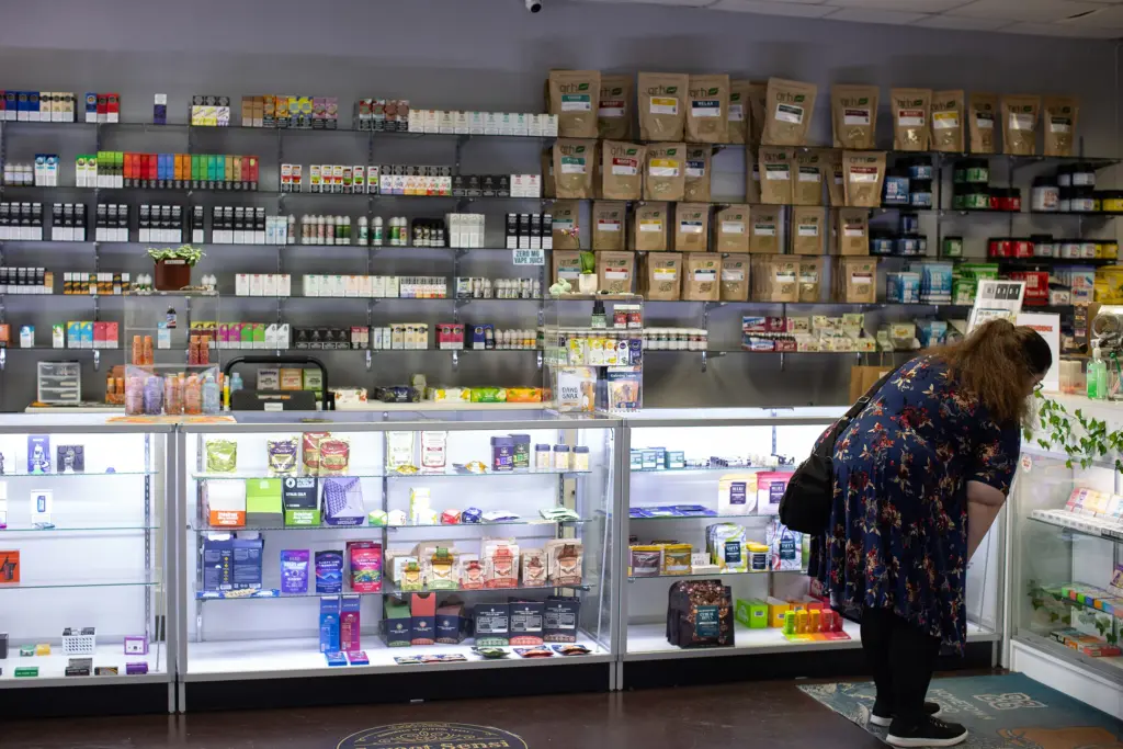 Customers browse product offerings at Austin Vape & Smoke in Austin. Many stores are offering a variety of products and merchandise to offset losses in revenue from the on again, off again smokeable hemp bans.