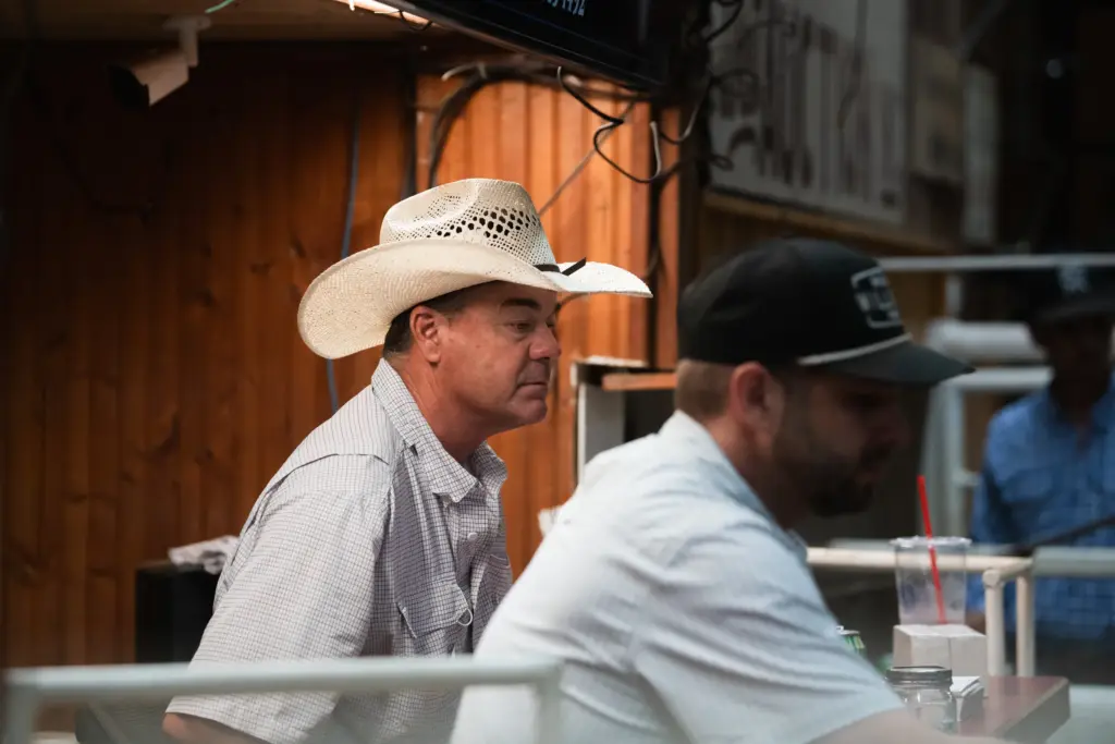 Brian Uptmore and Bodie Gist auction off cattle at the West Auction barn in West, Texas on Thursday, June 11, 2026.
