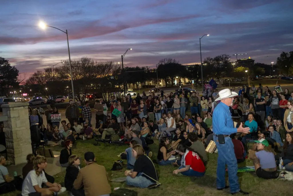 After reaching capacity, San Marcos residents outside city hall listen to a City Council meeting for a proposed AI data center on Tuesday, Feb. 17, 2026. Hundreds gathered inside and outside, some in opposition and others in support of the rezoning.