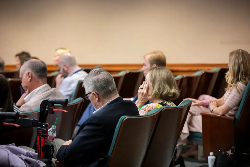 A member from the public wipes tears away as Vice Chair Joe Moody gives final remarks at the House General Investigating Committee on the July 2025 Flooding Events meeting in Austin on Thursday, June 16, 2026.
