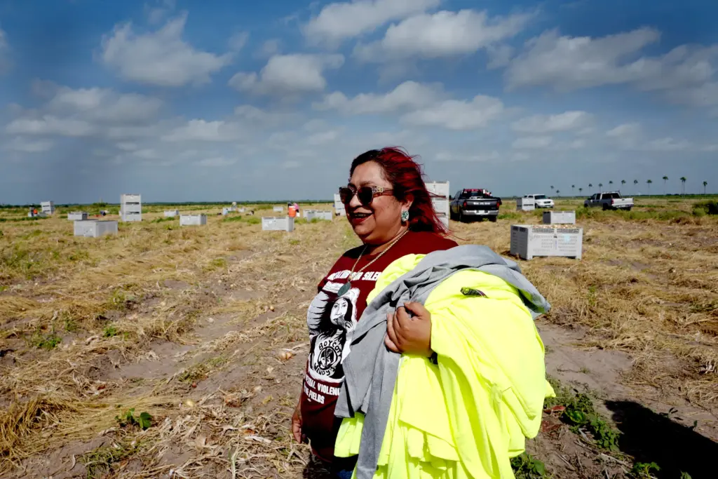 Social worker and farmworker advocate Elizabeth Rodriguez delivers long-sleeved shirts to fieldworkers in Edinburg, Texas. Many of the people she visits don’t have access to gloves and other equipment that can reduce the risks they face on the job. Those who are undocumented and don’t speak English are especially defenseless.