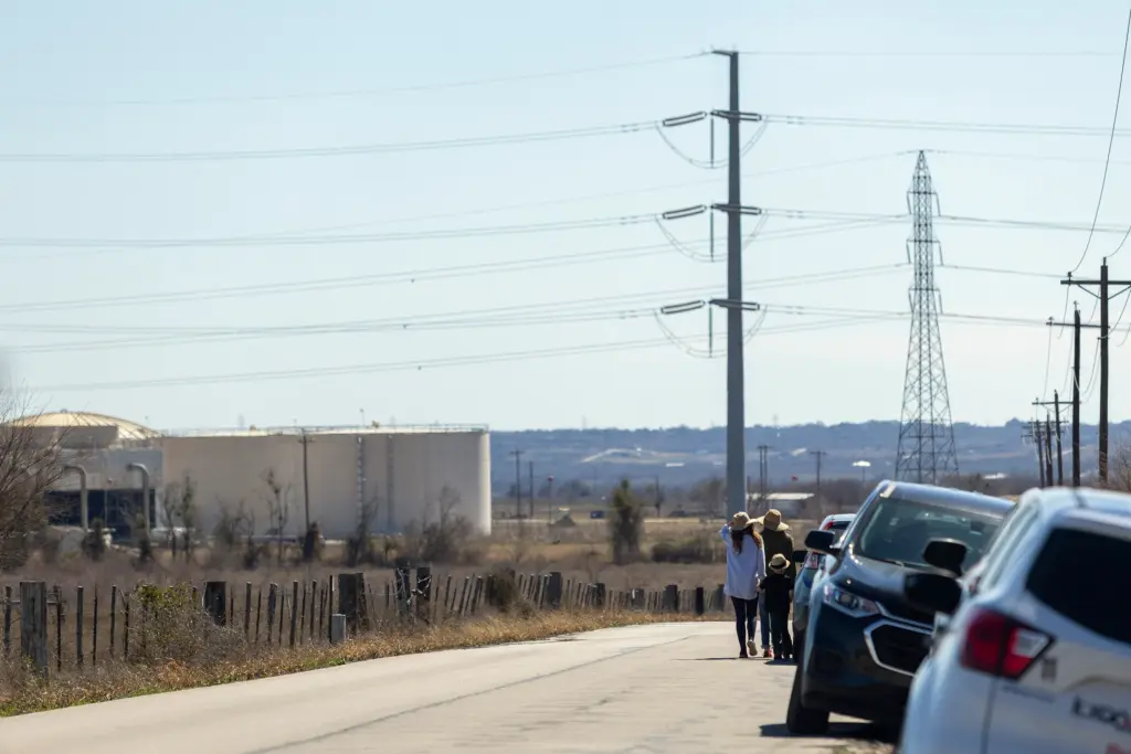 Attendees walk home after a press conference held on the site of the proposed San Marcos data center on Feb. 16, 2026.
