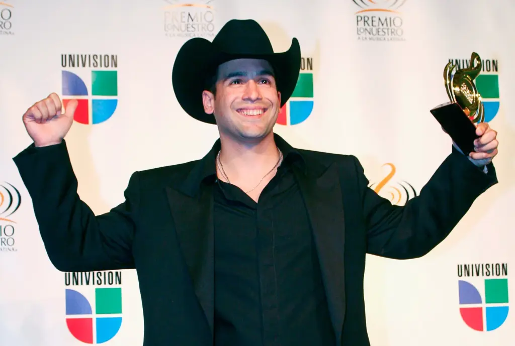 Tejano singer Bobby Pulido of Edinburg holds his award backstage at the Premio lo Nuestro latin music awards show in Miami on February 22, 2007.