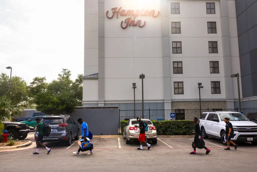 The reVision leave their hotel before they head out to play the regional final of the US Youth Soccer Presidents Cup, on June 14, 2026, in Round Rock. (Antranik Tavitian for The Texas Tribune)