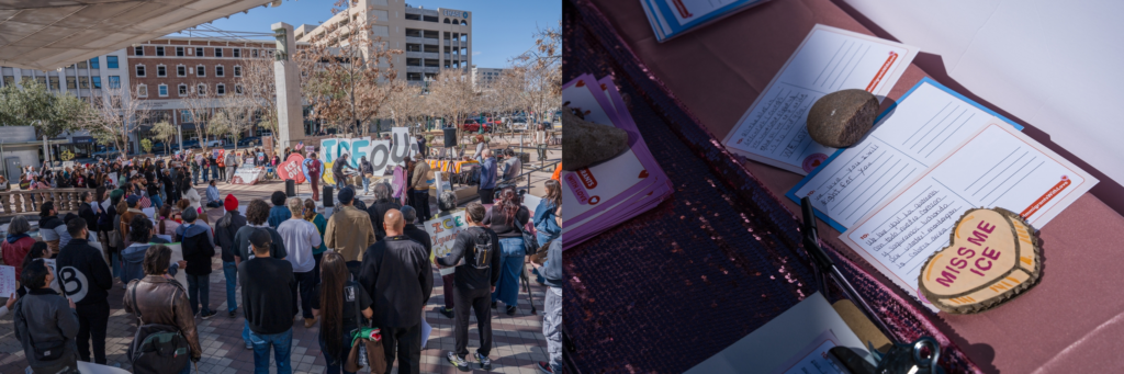 A large crowd of people gathers in an urban plaza for an outdoor demonstration. Activists hold large cutout letters spelling