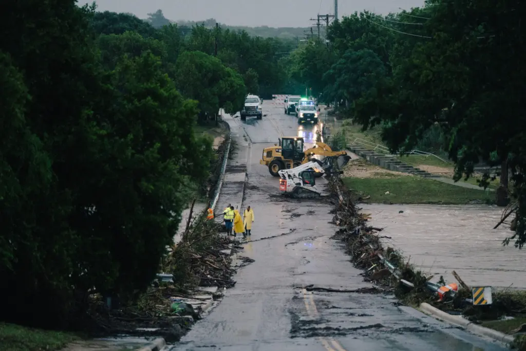 First responders on a bridge covered by water after the flood in Kerrville on July 16, 2026.