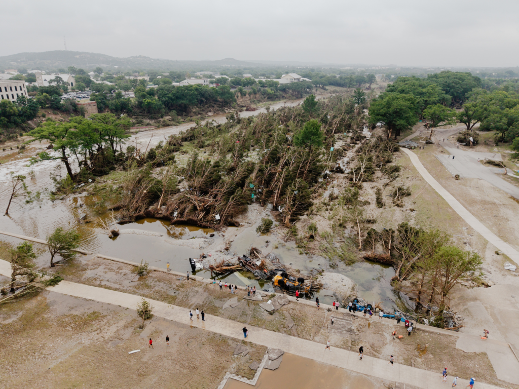 Community members look at the damage caused by the flood on Louise Hays Park in Kerrville on July 5, 2025.
