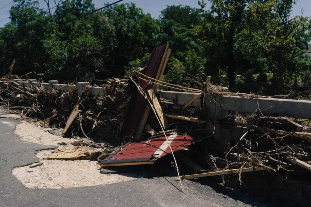 Almost two weeks after the July 16 flood, the Arcadia Loop bridge in Kerrville remains clogged with detritus.