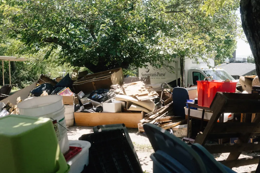 A Samaritan’s Purse truck parked outside of a home that is being gutted after being damaged by the July 16 flood, in Kerrville on July 28.