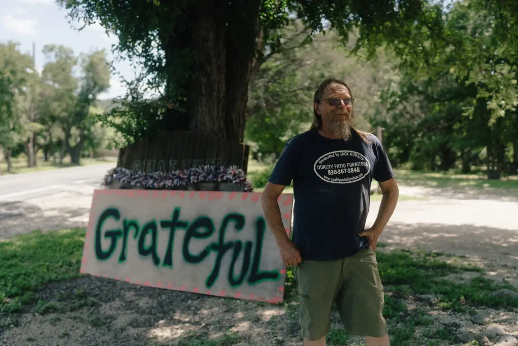 Jack Hudson next to his “grateful” sign at his Quality Patio Furniture business in Ingram on July 27.