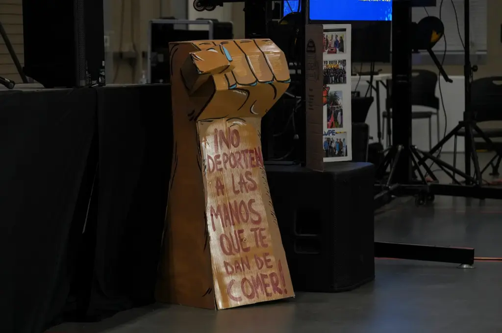 A gigantic three-dimensional cardboard fist with the message in Spanish that reads “Don’t deport the hand that feeds you” is seen during the La Unión del Pueblo Entero biennial Cumbre de Miembros 2026 at the Pharr Development and Research Center in Pharr, Texas on August 29, 2026.